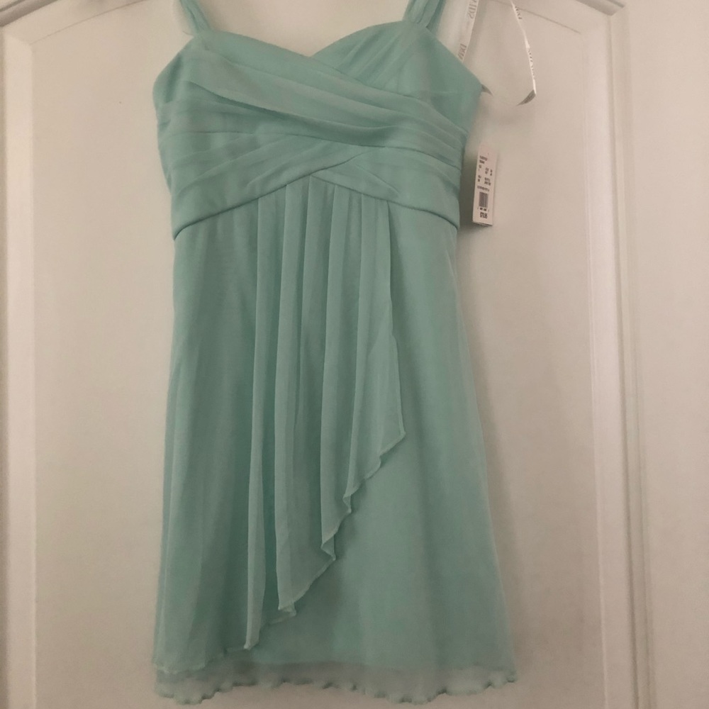 Mint green junior bridesmaid dress.